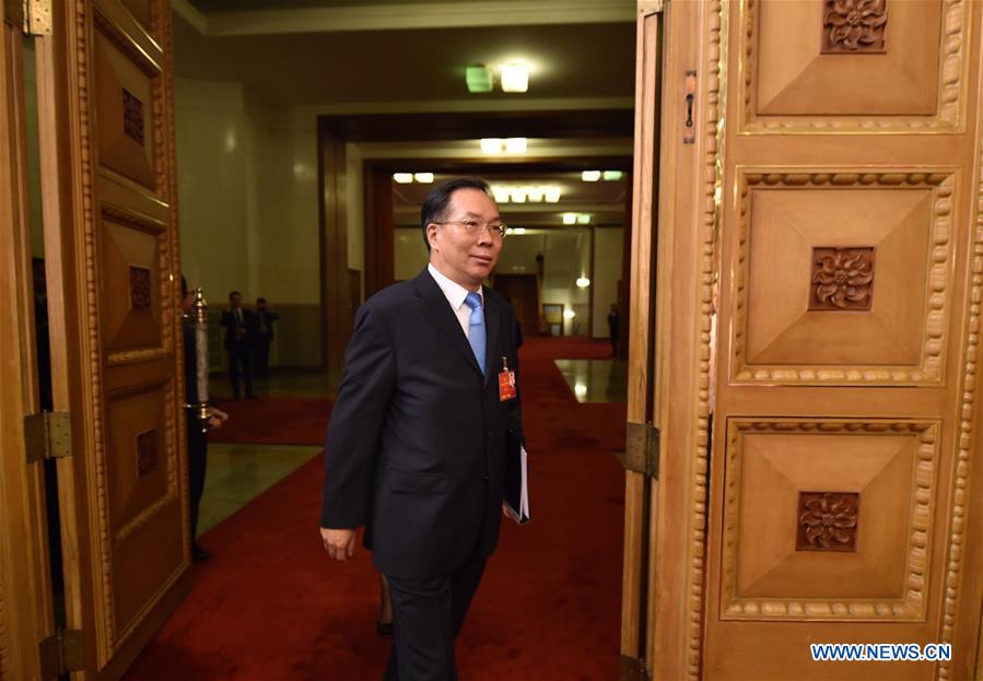 Wang Guoqing, spokesperson for the Fourth Session of the 12th Chinese People's Political Consultative Conference (CPPCC) National Committee, walks to attend a press conference in Beijing, capital of China, March 2, 2016. 
