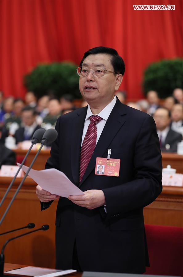Zhang Dejiang, chairman of the Standing Committee of China's National People's Congress (NPC), presides over the opening meeting of the fifth session of the 12th NPC in Beijing, capital of China, March 5, 2017. (Xinhua/Lan Hongguang)