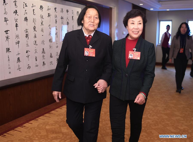 Shen Jilan (L) and Guo Fenglian, deputies to China's 12th National People's Congress (NPC) from Shanxi Province, walk to attend a panel discussion of the annual session of the NPC in Beijing, capital of China, March 7, 2017. The International Women's Day falls on March 8, during the ongoing sessions of China's National People's Congress (NPC) and the Chinese People's Political Consultative Conference (CPPCC). (Xinhua/Yan Yan)