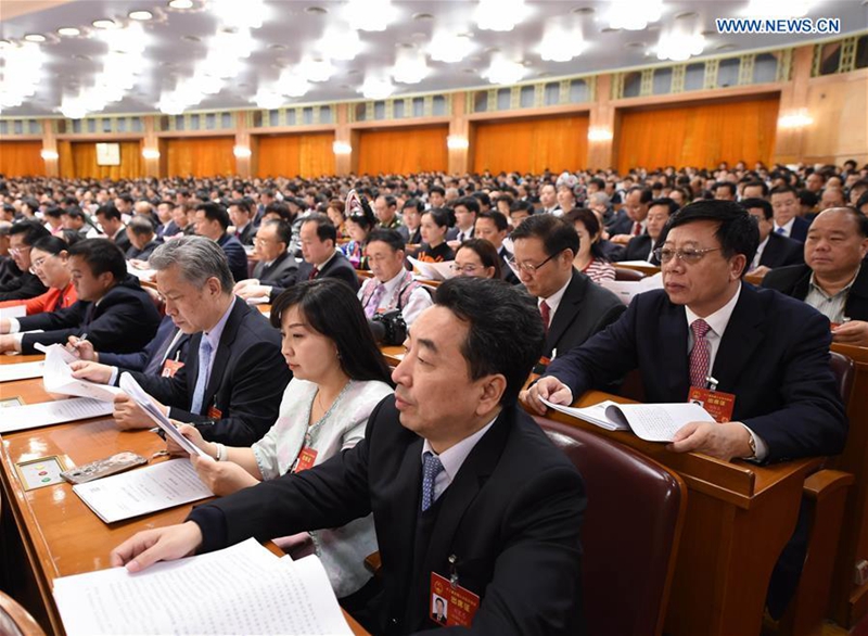 Deputies to China's 12th National People's Congress (NPC) attend the third plenary meeting of the fifth session of the 12th NPC at the Great Hall of the People in Beijing, capital of China, March 12, 2017. (Xinhua/Yang Zongyou)
