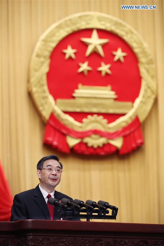 Chief Justice Zhou Qiang delivers a work report of the Supreme People's Court at the third plenary meeting of the fifth session of the 12th National People's Congress at the Great Hall of the People in Beijing, capital of China, March 12, 2017. (Xinhua/Lan Hongguang) 