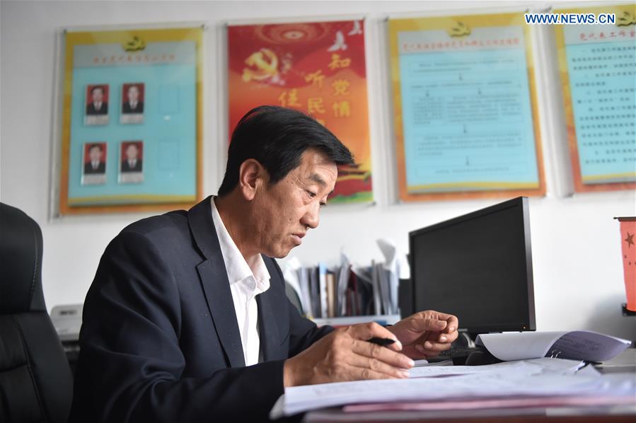 Zhu Yuguo, secretary of the Communist Party of China (CPC) branch of Zengjipan Village, works at his office in Yanchi County, northwest China's Ningxia Hui Autonomous Region, Sept. 20, 2017. Zhu has been elected as a delegate among 2,287 delegates to attend this year's congress to be held in Beijing starting Oct. 18. Attendees will include high-ranking government officials, Party leaders, and military officers as well as grassroots Party members from 