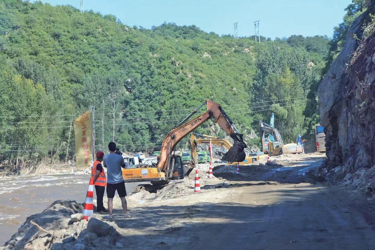 7月30日，密云区，通往冯家峪镇西火路的道路通车。　新京报记者　王飞　摄
